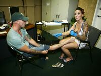 Emily Parker Gives A Guy A Tattoo And Some Pussy!